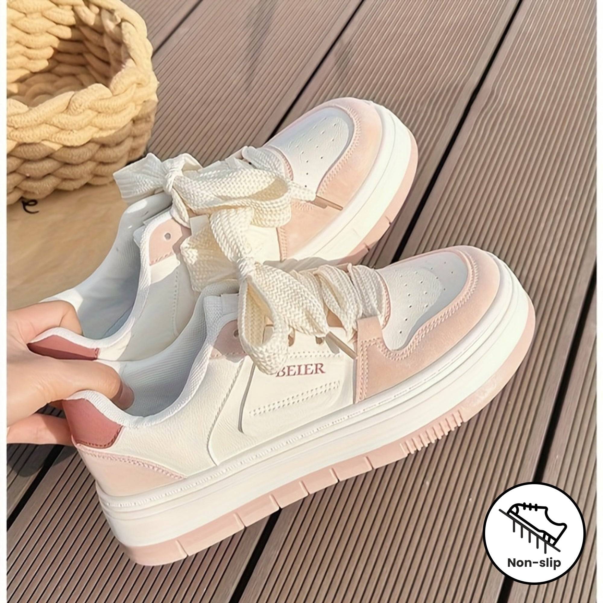 Pink and white women’s sneakers featuring a non-slip sole and soft round toe, designed for comfort and everyday walking.