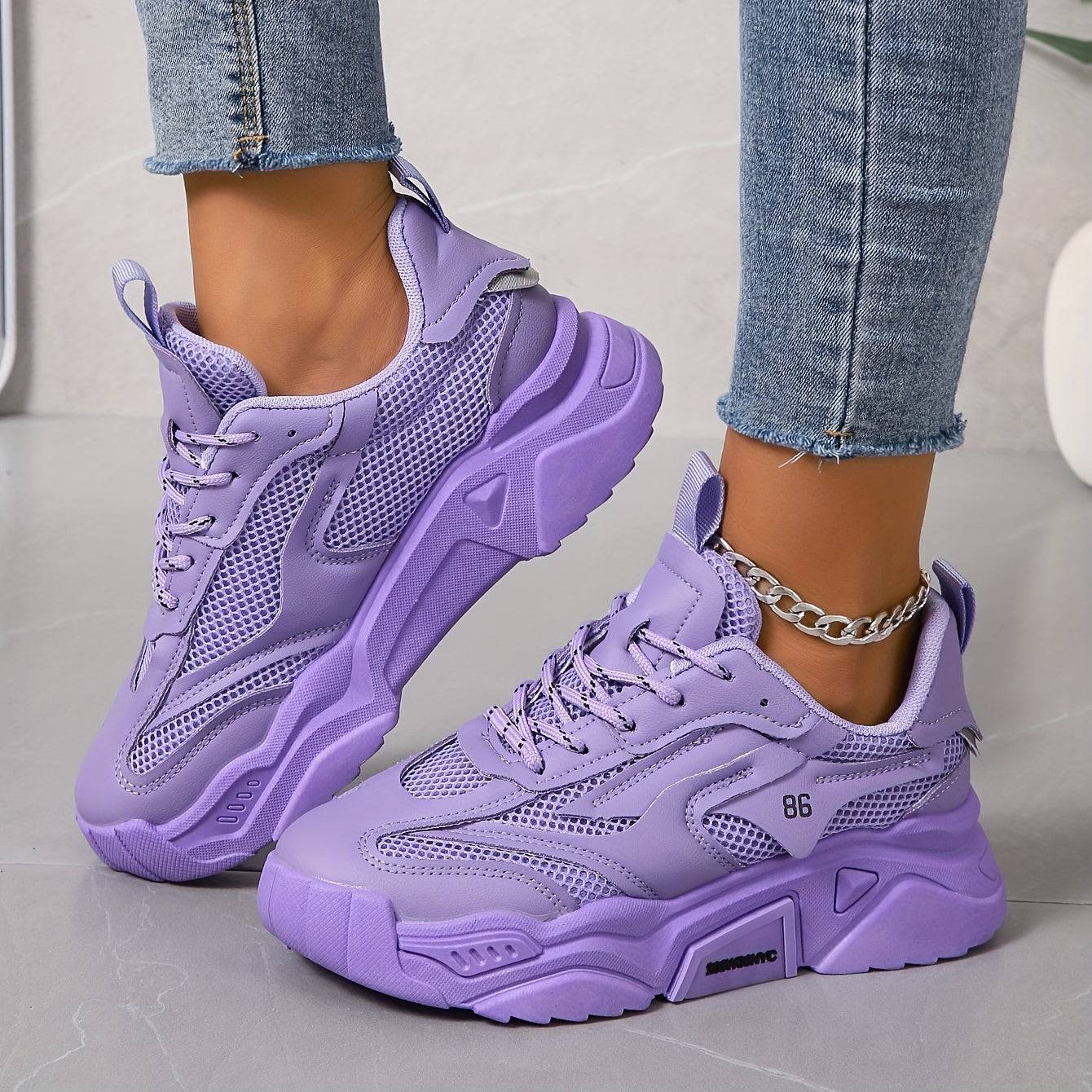 Lavender women’s sneakers featuring breathable mesh panels, cushioned sole, and lace-up closure for stylish all-day comfort.