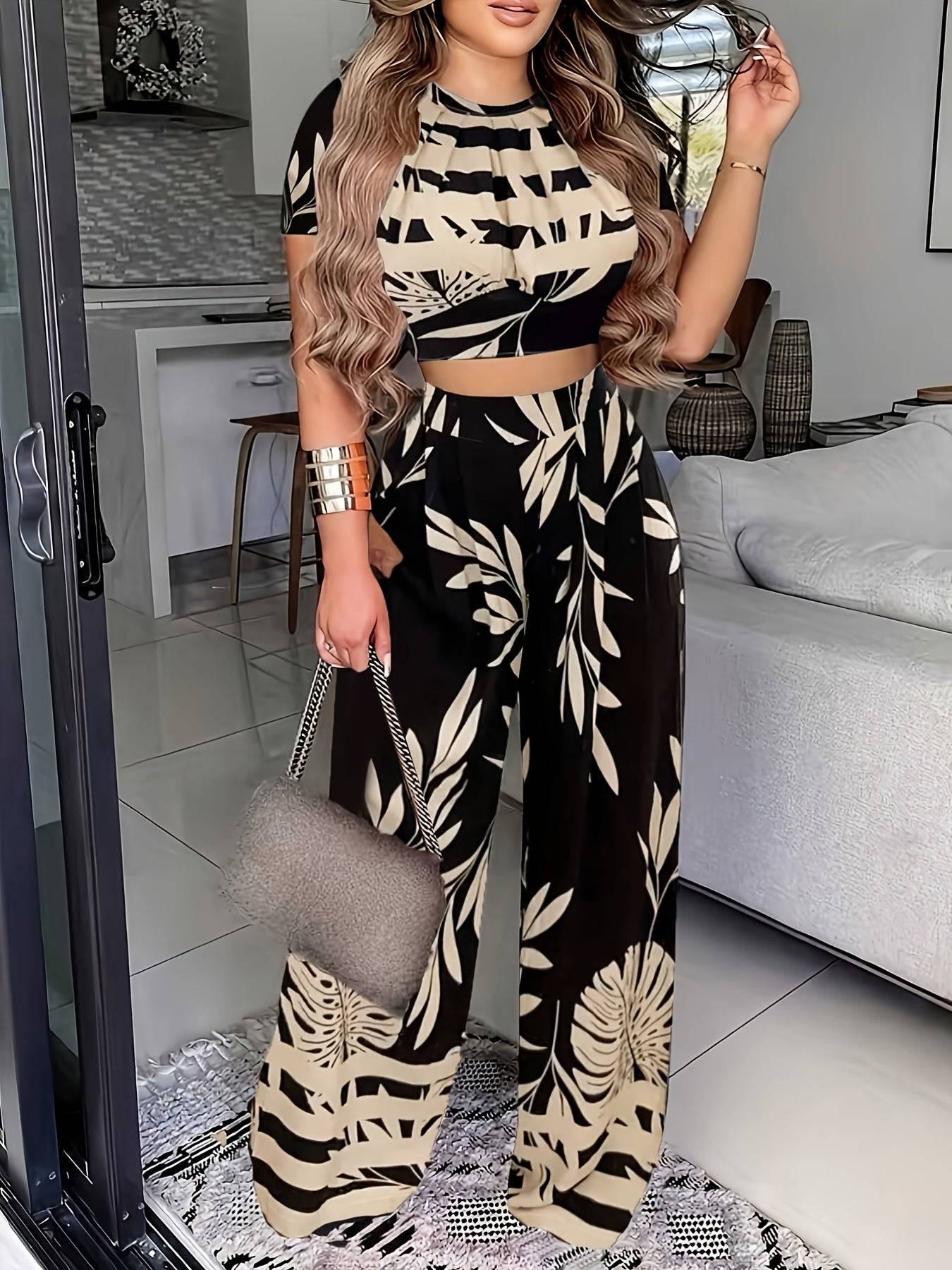 Stylish Women's 2-Piece Leaf Print Summer Set in black and beige, includes a fitted crop top and high-waisted wide-leg pants for a modern summer look.