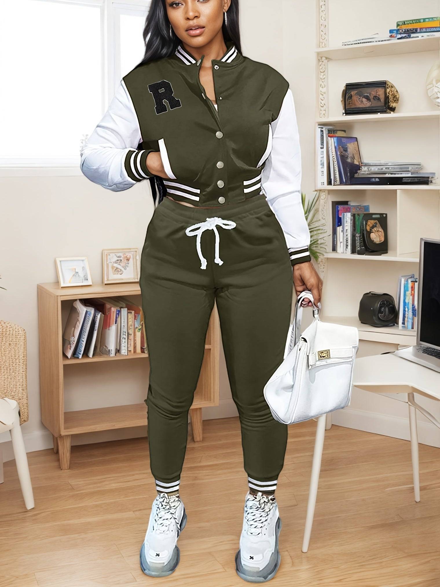 Olive green women’s 2-piece athletic set with varsity jacket and jogger pants, blending sporty functionality with modern fashion.