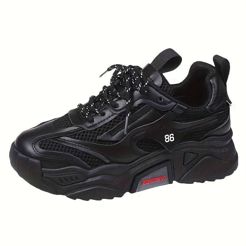 Black women’s low-top sneakers with cushioned sole and mesh panels, offering bold style and everyday comfort.