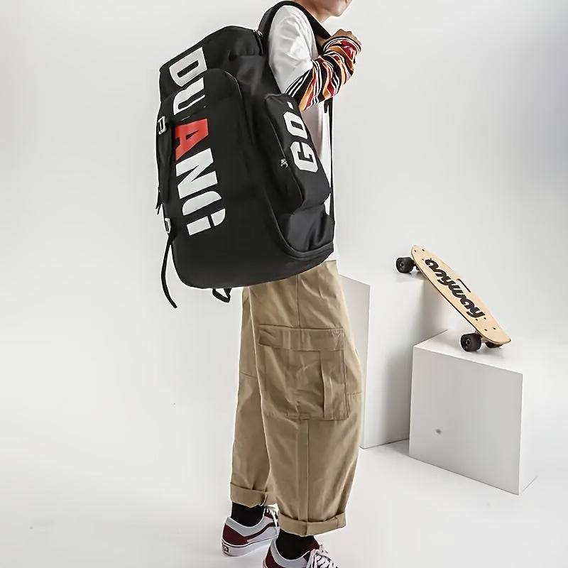 Model carrying black large travel backpack with DUANI print, showcasing adjustable straps and outdoor-ready design.