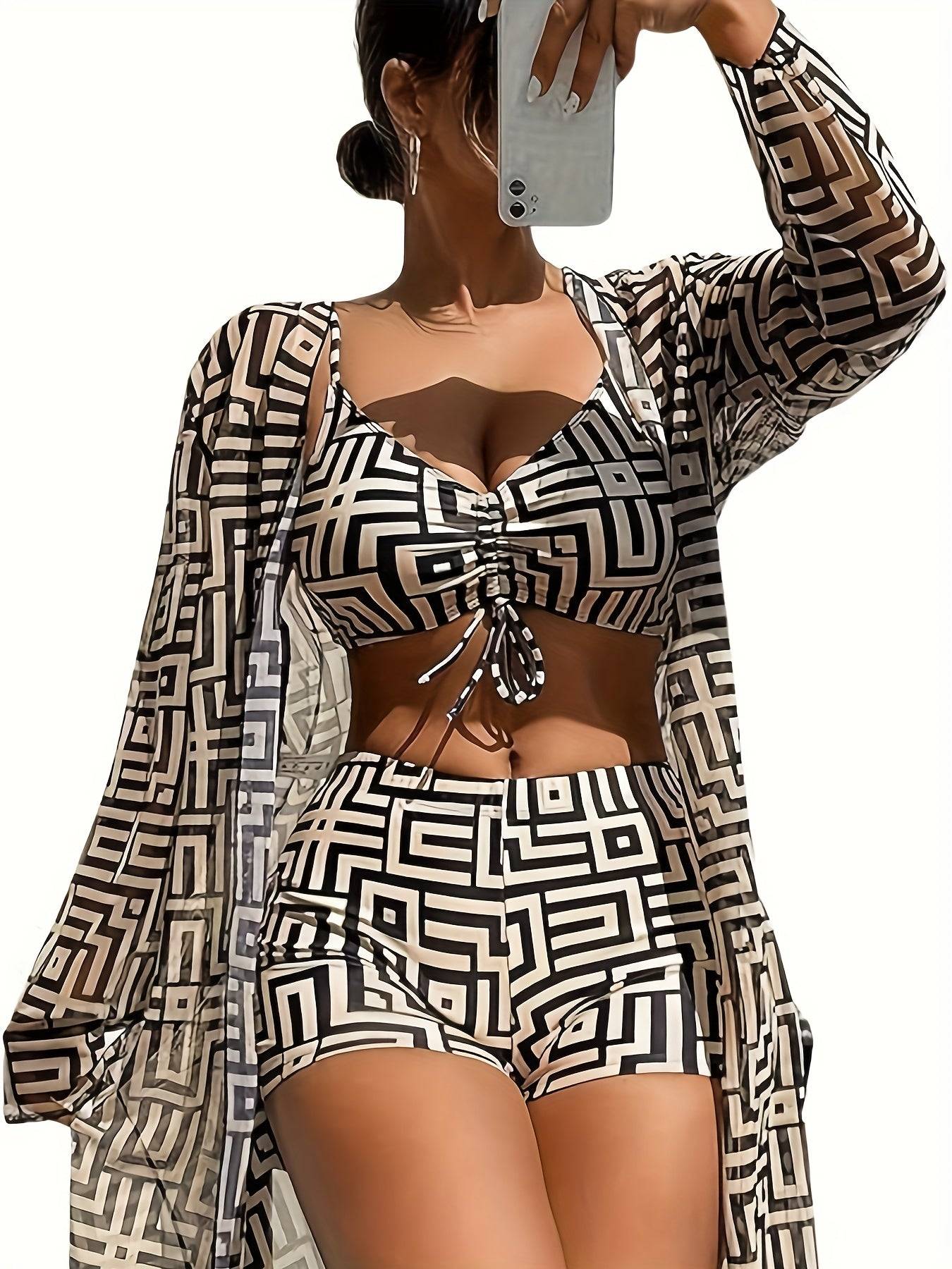 Close-up of 3pcs Women’s One-Shoulder Swimsuit Set showing ruched top, high-stretch shorts, and sheer printed cover-up in bold vacation-ready pattern.