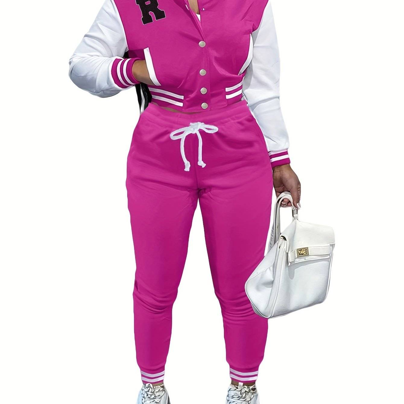 Hot pink women’s 2-piece athletic outfit with varsity jacket and jogger pants, combining sporty style with vibrant color.