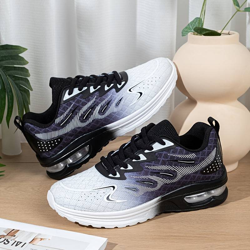 Stylish black and white women's mesh sneakers with gradient design and air cushion sole for lightweight, breathable support.