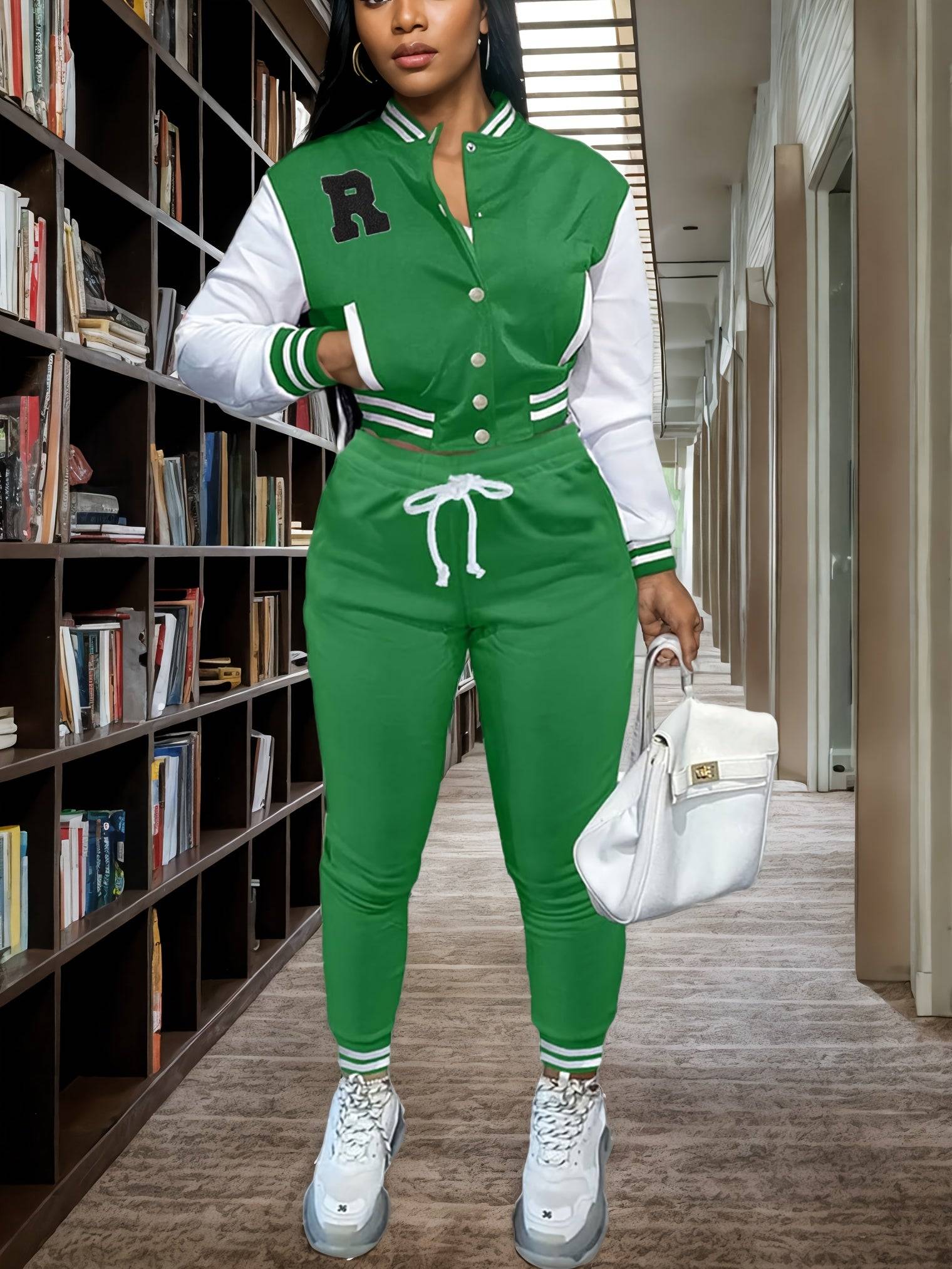 Women’s 2-piece sportswear set in green with crop top sweatshirt and buttoned letter jacket, paired with matching jogger pants, ideal for athletic wear.