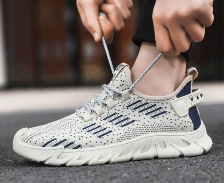 Men's lightweight running sneakers with soft sole and breathable mesh design in beige and navy, ideal for flexible athletic performance.