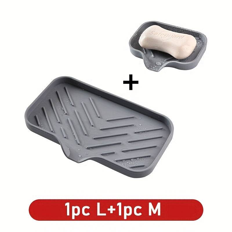 Set of 1 large and 1 medium silicone sink tray with drainage grooves, perfect for organizing soap and sponges on countertops.