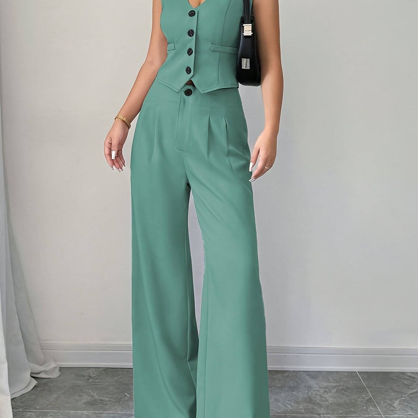 Front pose of Women's 2-Piece Summer Set in sage green with V-neck vest and pleated wide-leg pants, ideal for modern and elegant summer styling.
