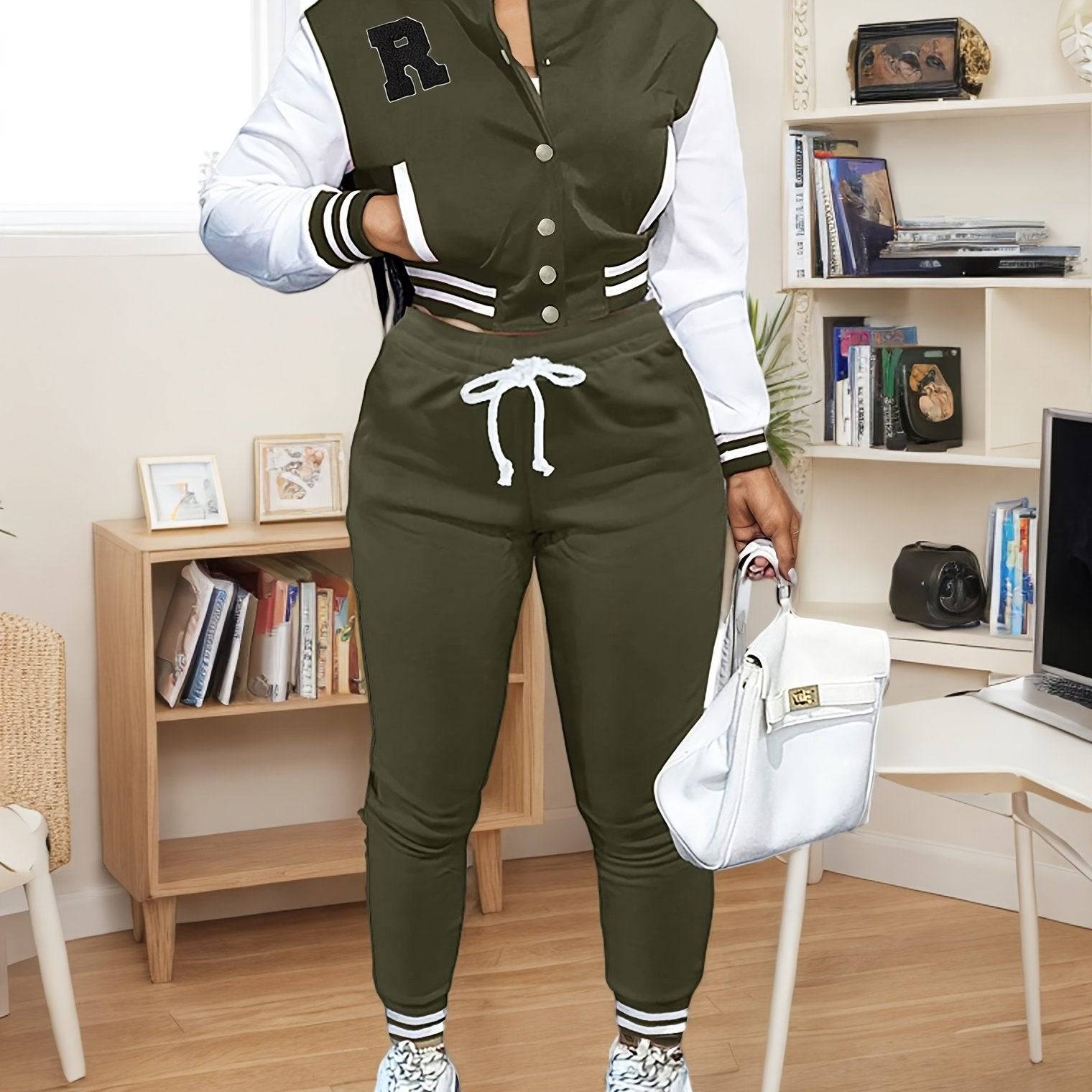 Olive green women’s 2-piece athletic set with varsity jacket and drawstring joggers, perfect for sporty and casual outfits.