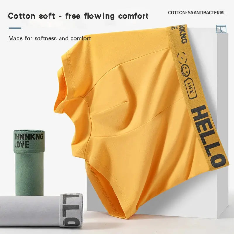 Yellow men's cotton boxer briefs with HELLO waistband, showcasing soft breathable fabric and antibacterial comfort for all-day wear.