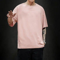 Men's casual pink T-shirt made from breathable cotton fabric.