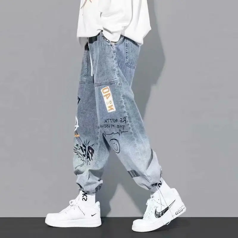 Side view of light blue graffiti-style cargo pants for men.