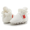 White newborn shoes with drawstring closure