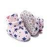 Pink newborn shoes with blue star pattern