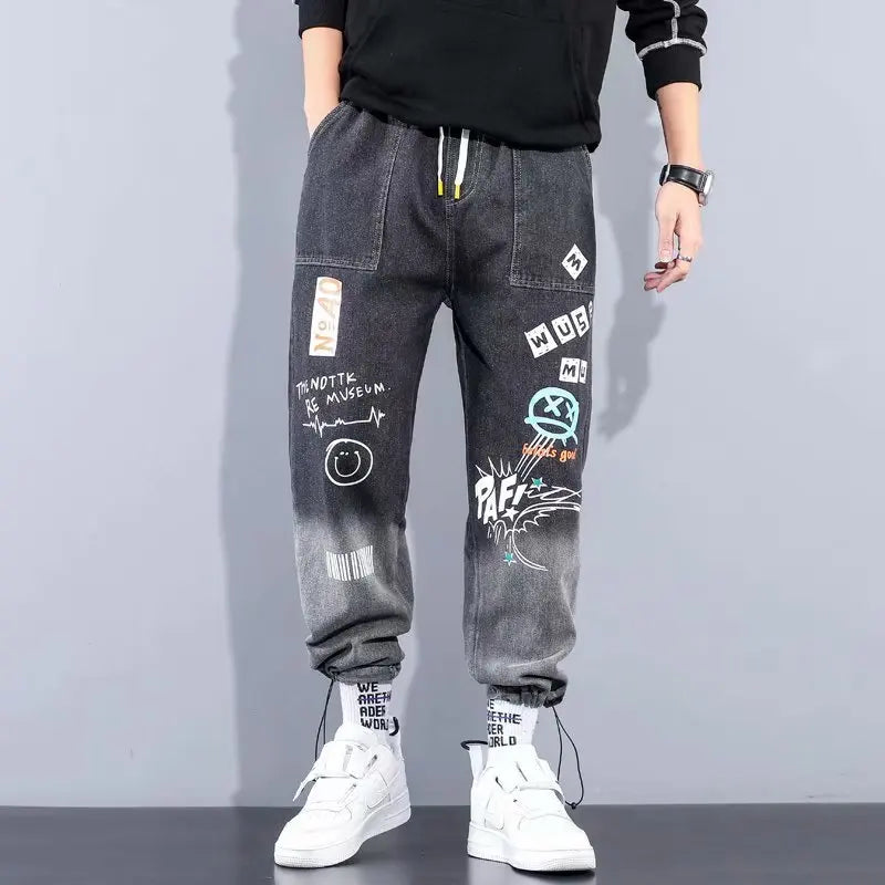 Dark gray graffiti-style cargo pants for men with elastic cuffs.