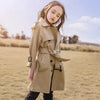 Teen girl in stylish long trench coat, perfect for autumn