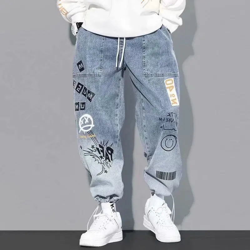 Light blue graffiti-style cargo pants for men with elastic cuffs.