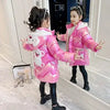 Girl in pink down jacket with bear design, posing in mirror