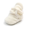 Cream fuzzy newborn shoe with soft texture