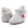 Light gray newborn shoes with drawstring closure