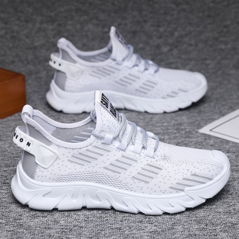 White men's running sneakers with breathable mesh upper and soft cushioned sole, offering a lightweight and flexible fit for workouts.