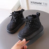 Black kids' boots with zip closure, durable design.