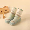 Green rabbit baby shoes with floral pattern