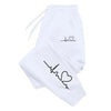 White jogging pants with heart line graphic