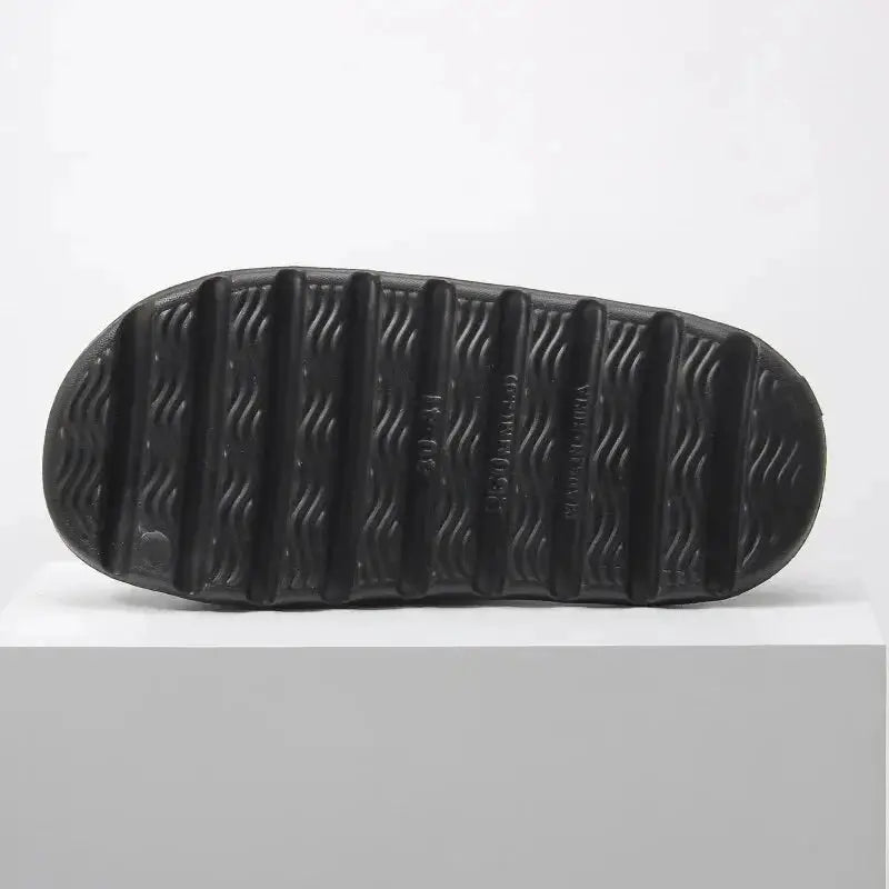 Bottom view of 1 Pair Cloud Cushion Slippers for Men & Women showing non-slip textured sole for enhanced grip and stability.