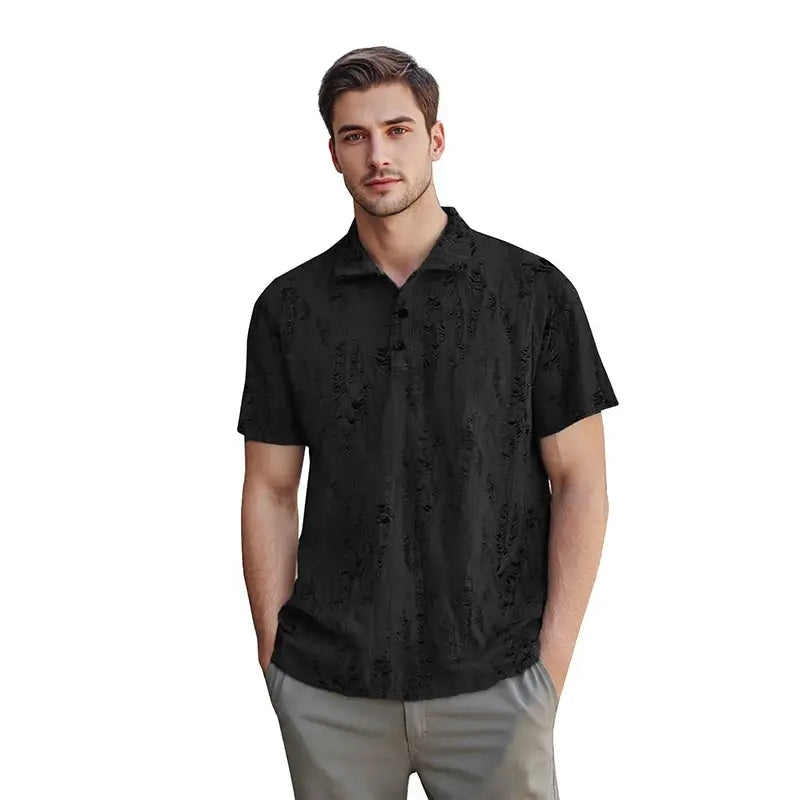 Model in black men’s short sleeve T-shirt with buttoned V-neck and worn-look texture, styled for relaxed summer fashion.