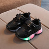 Black LED sneakers for kids with light-up soles.