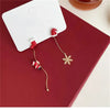 Santa and snowflake asymmetrical earrings