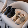 Stylish kids' boots in black and beige, breathable leather.