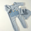 Blue newborn footed jumpsuit with pom-pom hat