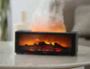 Aroma humidifier with flame effect on a table