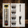 Gold electric shaver with intricate design and accessories