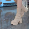 Side view of beige women's round toe boots