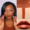 Rich brown liquid lipstick on model's lips