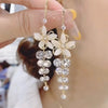 Floral crystal dangle earrings with cascading gems