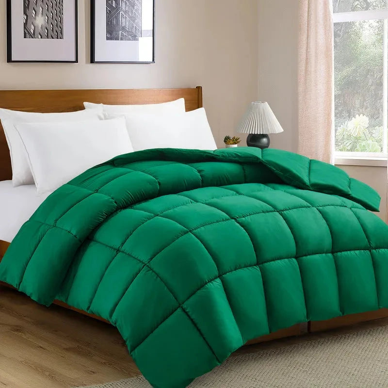 Green reversible microfiber comforter set with pillow shams on a wooden bed, offering cozy and durable bedding for all seasons.