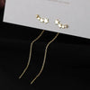 Gold star-shaped crystal thread chain earrings