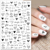 Black leaf nail art stickers on grey background