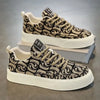 Men's sneakers with black swirl pattern on beige