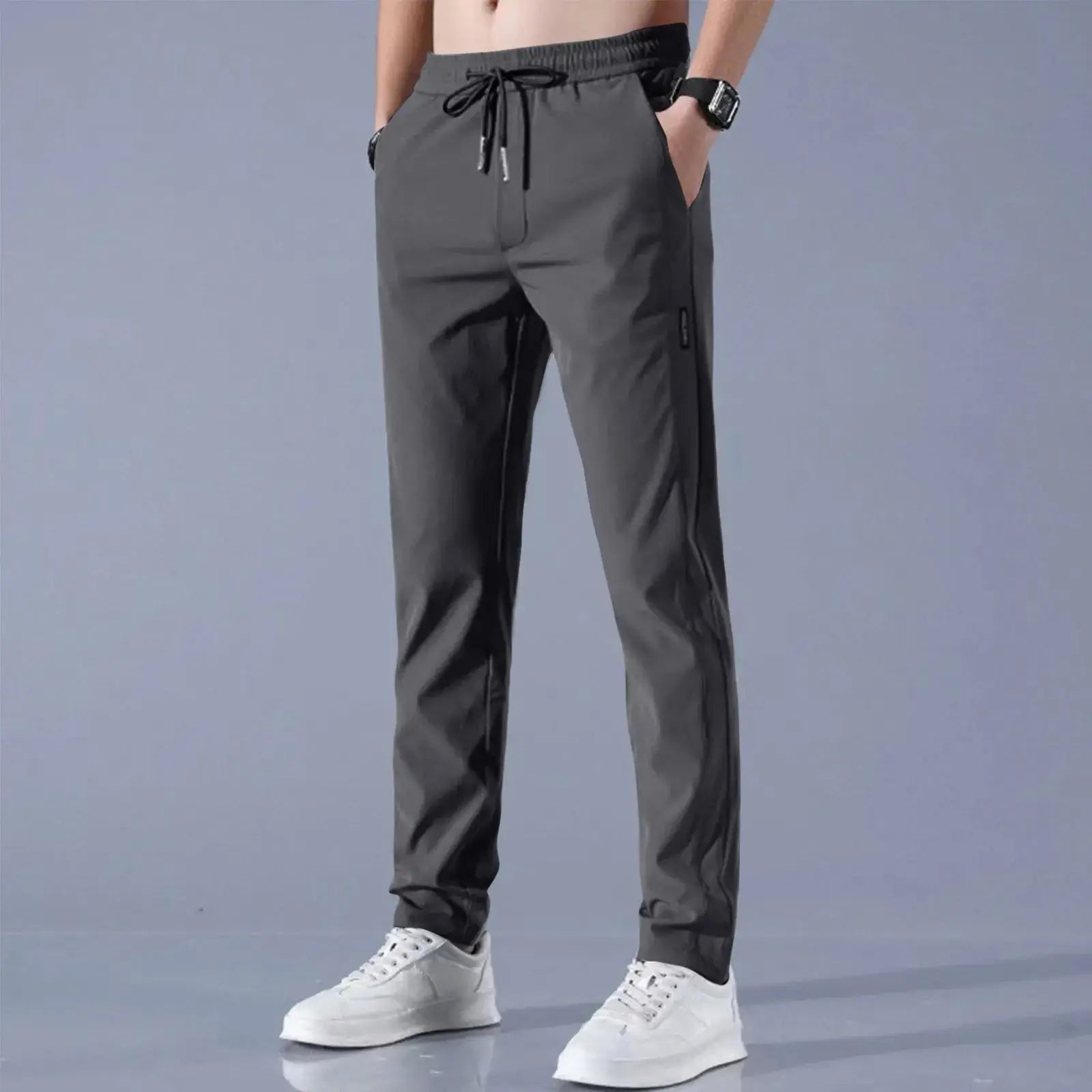 Charcoal gray men’s quick-dry stretch pants with breathable ice silk fabric, mid-waist loose fit and straight-leg silhouette for everyday use.