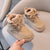 Beige kids' boots with fur lining, anti-slippery sole.