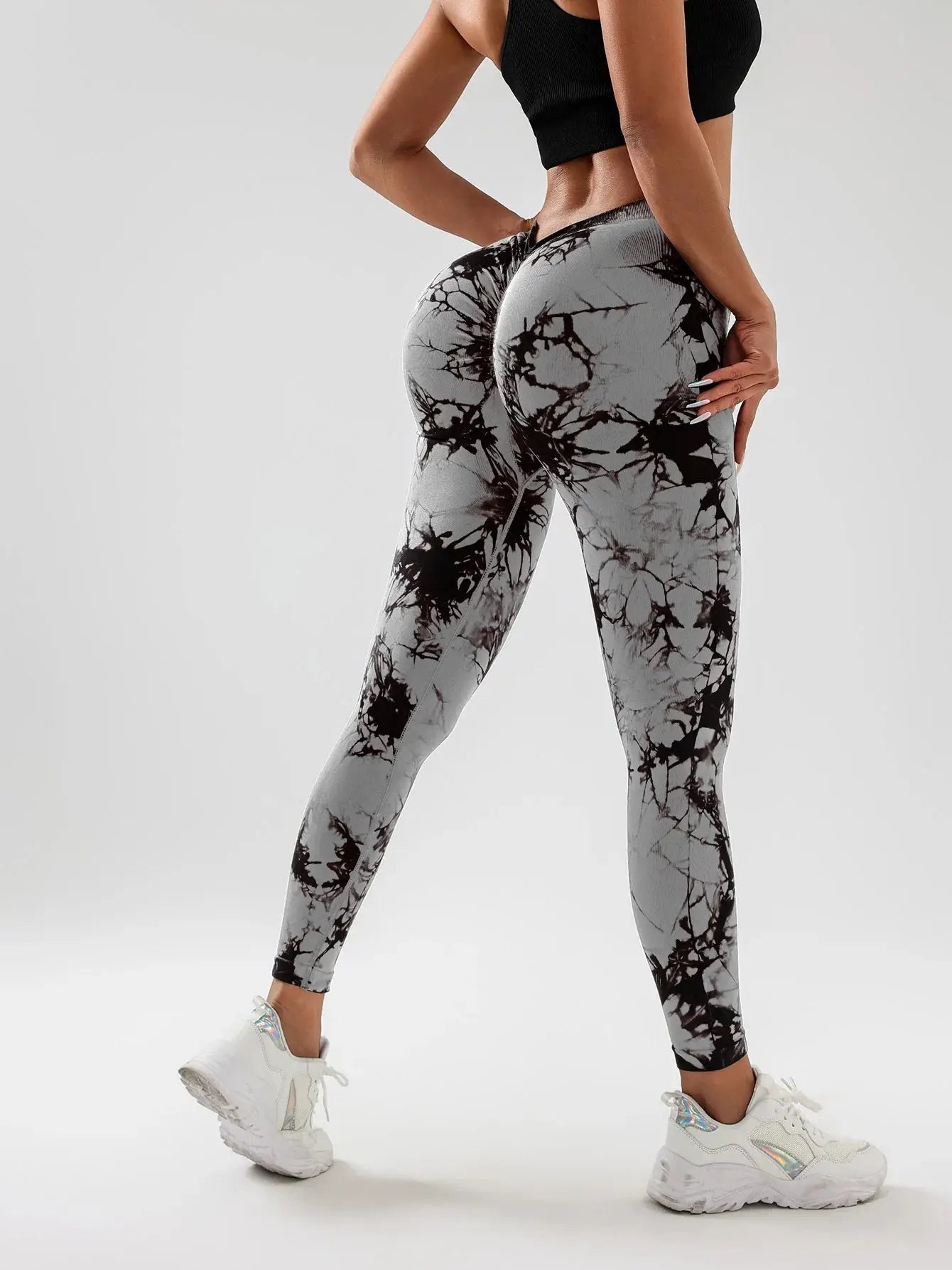 Back view of gray US Women's Spandex Tie Dye Scrunch Butt Lifting High Waist Leggings showing contouring fit and ruched design for enhanced curves.