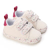 White baby shoes with floral straps