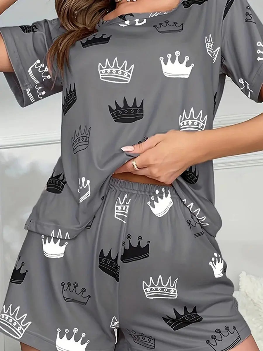 Women's 2-piece pajama set in gray with crown print, featuring a short sleeve top and elastic waist shorts for sleep or loungewear comfort.