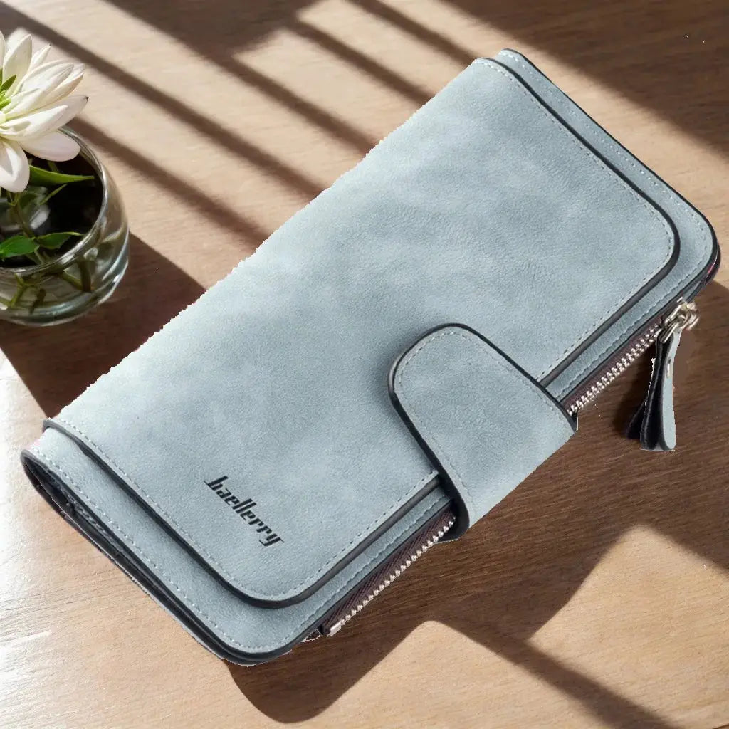 Light blue women's long trifold wallet with spacious interior and secure compartments for cards, phone, and cash.